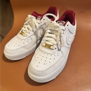 Nike Red and White Sneakers with Gold Accents